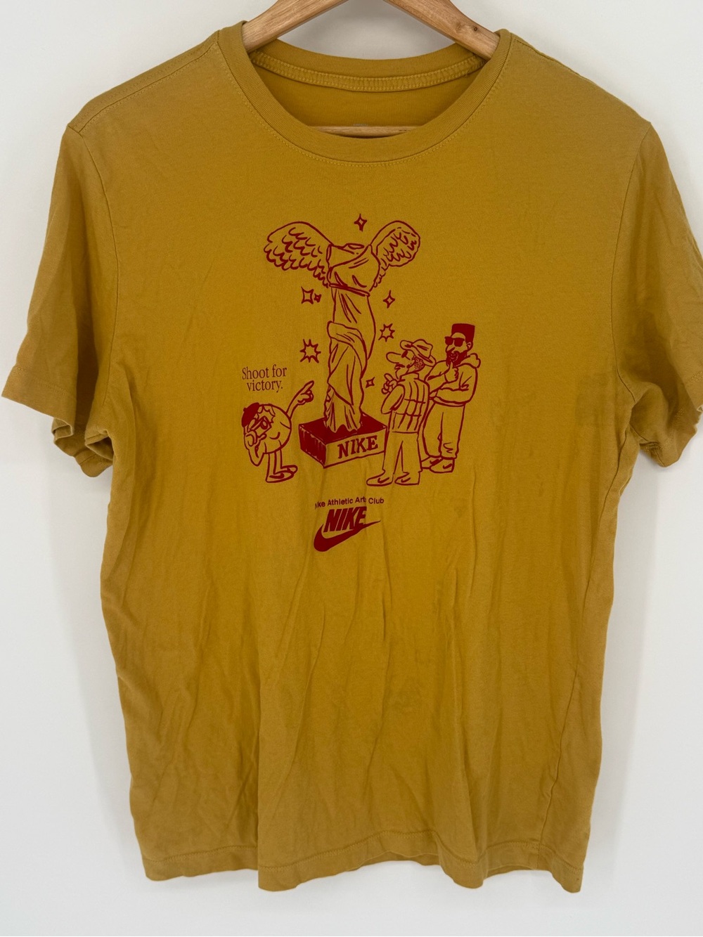 Nike Men’s Mustard Short-Sleeve Graphic Tee with Red Print